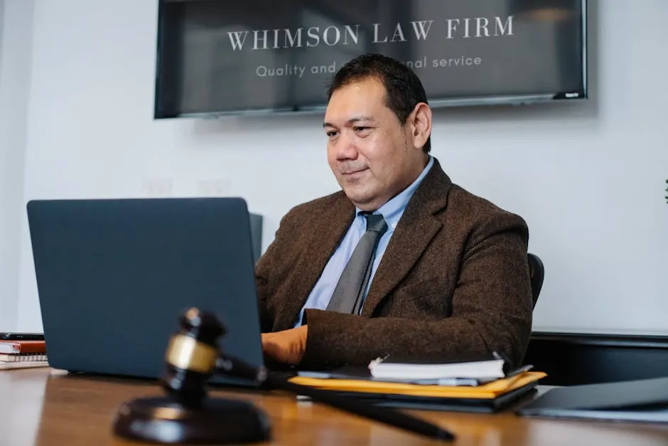 Halberd & Stone attorney reviewing a closed-matter file at a desk with a gavel and notebook