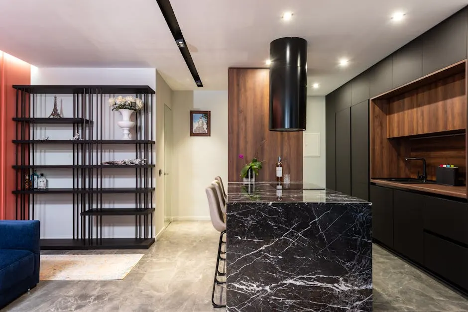 Modern kitchen with marble island and wooden cabinets — Cantonments residence