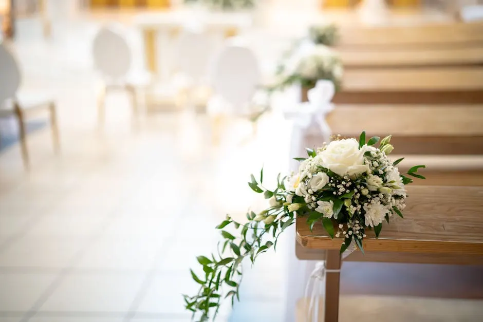A bride and groom in a soft, embracing moment during a coastal ceremony